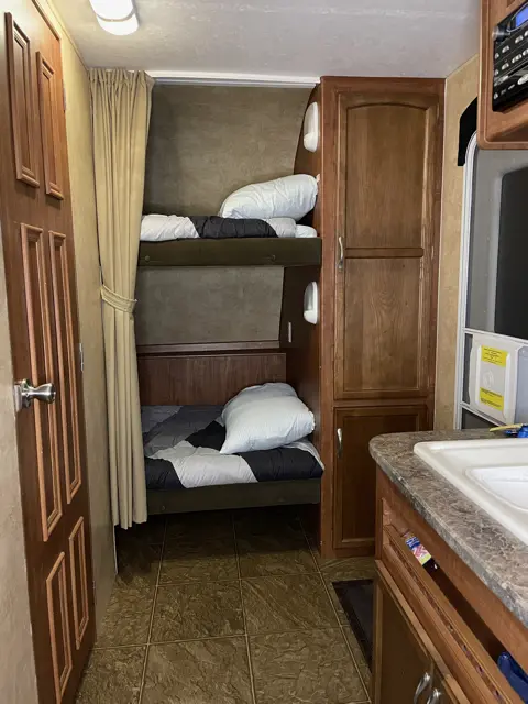 Bunk Beds of RV Rental trailer Blue Jay Getaway located at Kindlewood Camping in the Berkshires of Western Massachusetts
