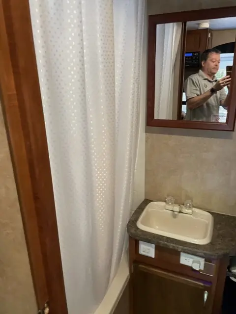 Bathroom shower of RV Rental trailer Blue Jay Getaway located at Kindlewood Camping in the Berkshires of Western Massachusetts