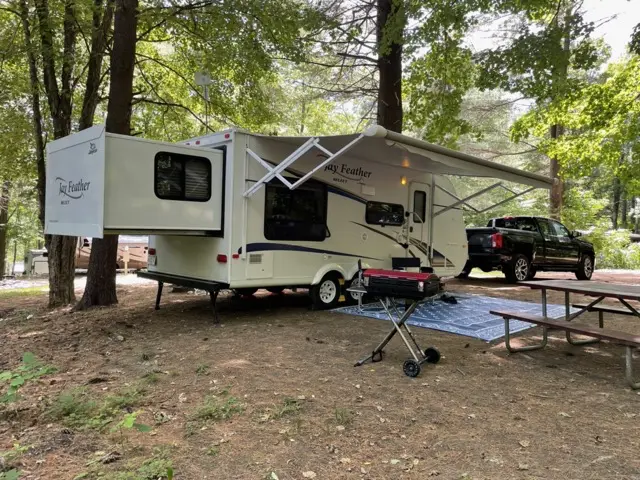 Delivered, set up, ready camping service RV Rental trailer Blue Jay Getaway located at Kindlewood Camping in the Berkshires of Western Massachusetts