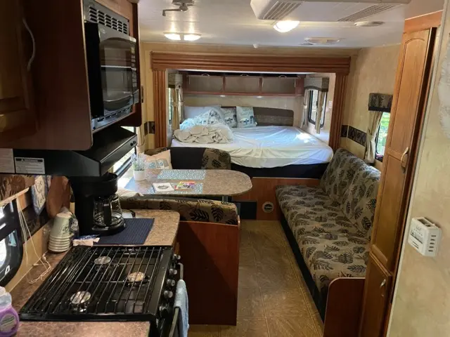 Blue Jay Getaway setup kitchen sink, stove and coffee pot