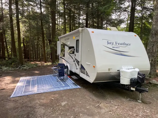 Blue Jay Getaway setup with awning and slideout